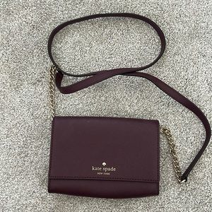 Plum colored Kate Spade wristlet
